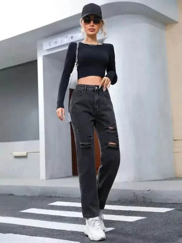 Black ripped straight-leg jeans paired with a cropped long-sleeve top.