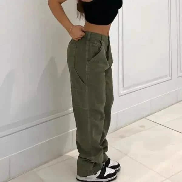 Olive green cargo pants paired with a black crop top and Nike sneakers.