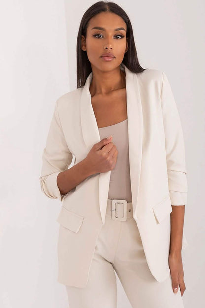 Crisp white blazer with three-quarter length sleeves and a shawl collar.