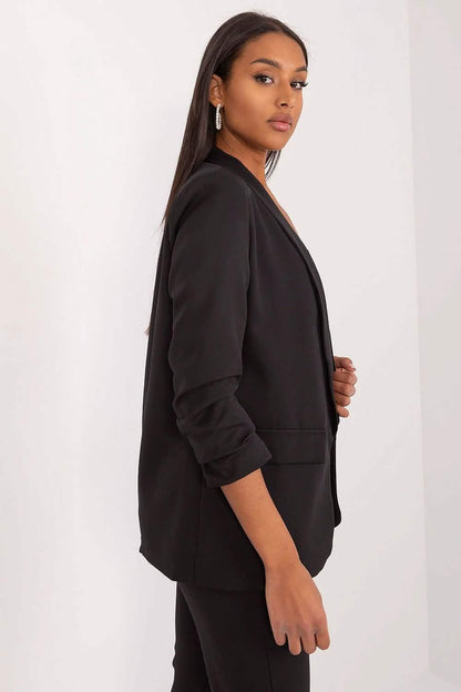 Black blazer with ruched sleeves and an open front design.