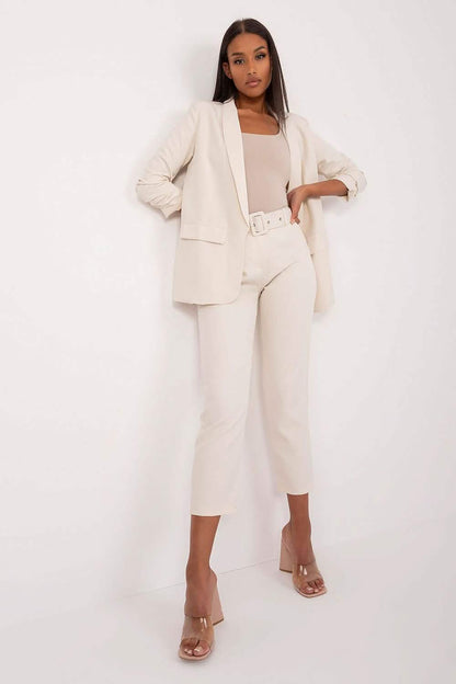 Cream-colored business suit with cropped pants and matching blazer.