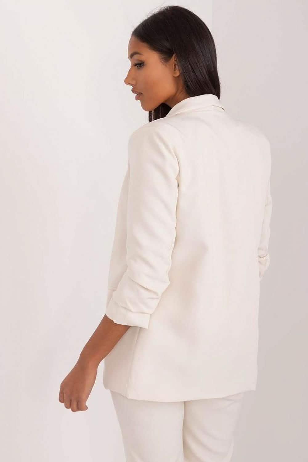 White blazer with three-quarter length sleeves shown from a side view.