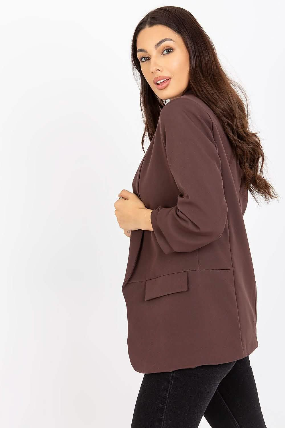 Brown oversized blazer with flap pockets and long sleeves.