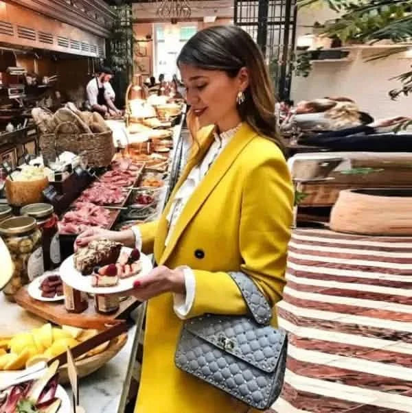 Bright yellow double-breasted blazer coat.