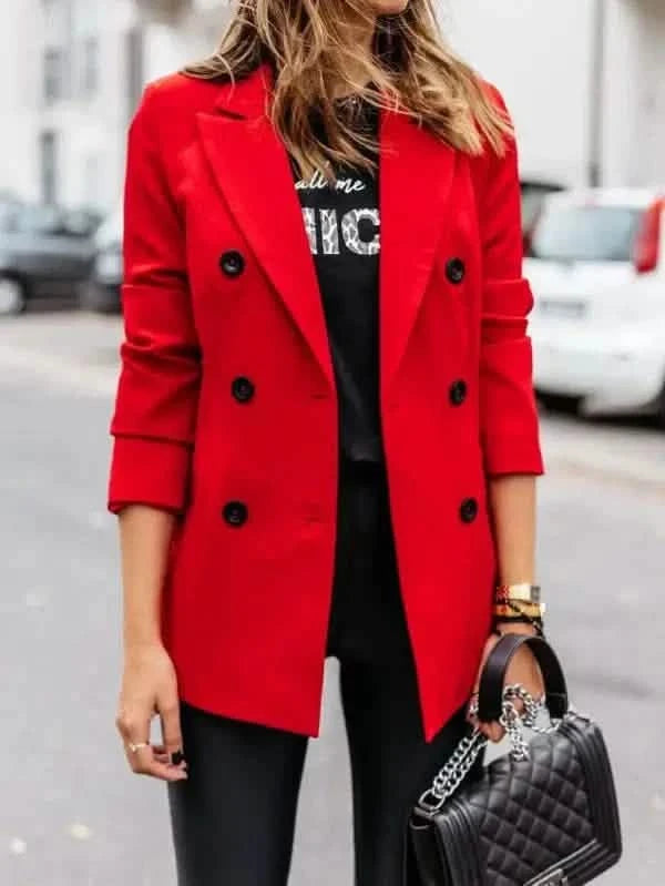 Bright red double-breasted blazer with black buttons.