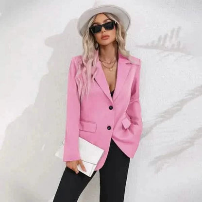 Pink tailored blazer with black button details.