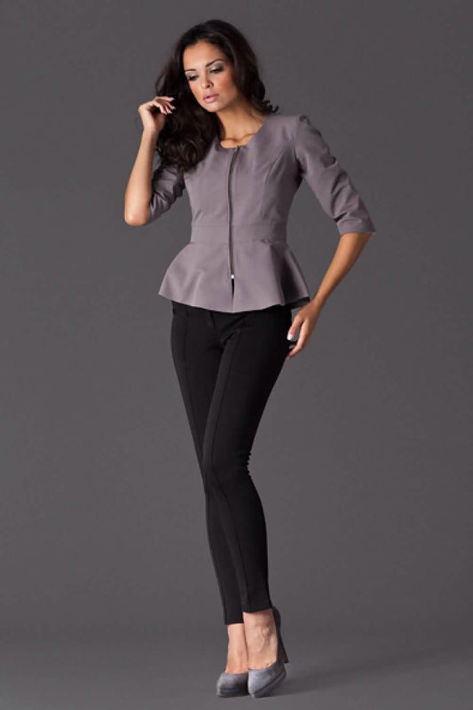 Stylish grey peplum jacket paired with black skinny pants and heels.