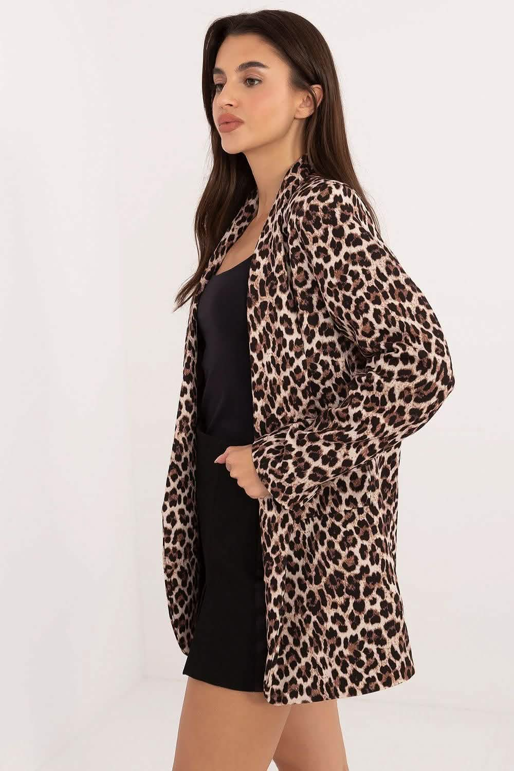 Leopard print coat with pockets worn over a black dress.