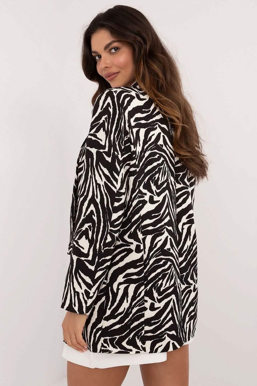 A black and white zebra-print blazer with long sleeves.