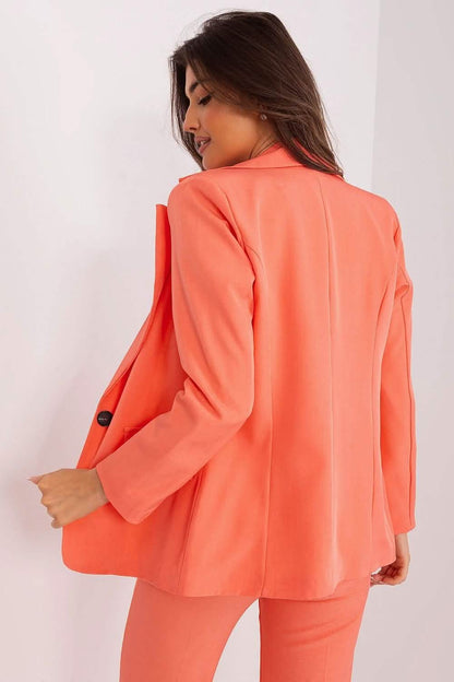 Coral-colored blazer with long sleeves and a tailored fit.