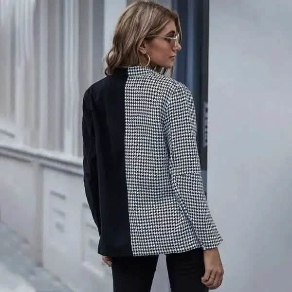 Half houndstooth, half solid black blazer with a split design down the middle.